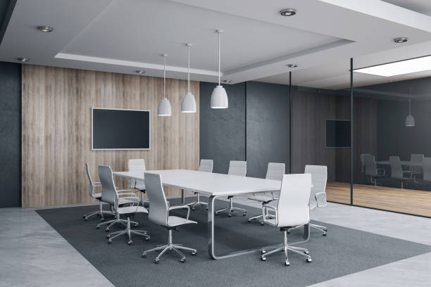 Modern meeting room interior with empty tv screen and sunlight. Workplace and company concept. 3D Rendering